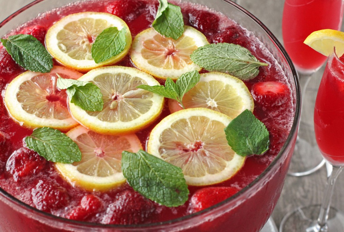 Champagne Punch on the table with lemons and peppermint