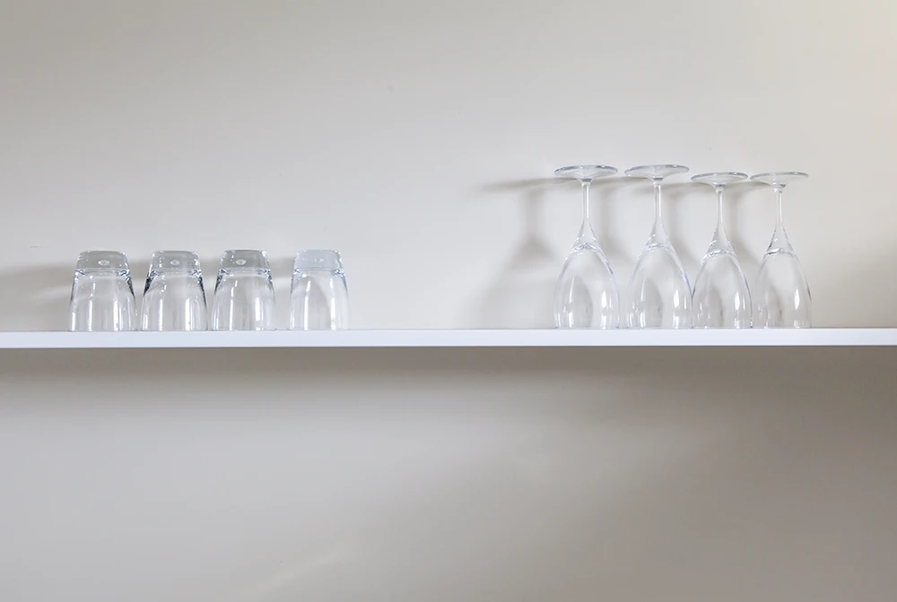 Wine And Juice Glasses On Shelf